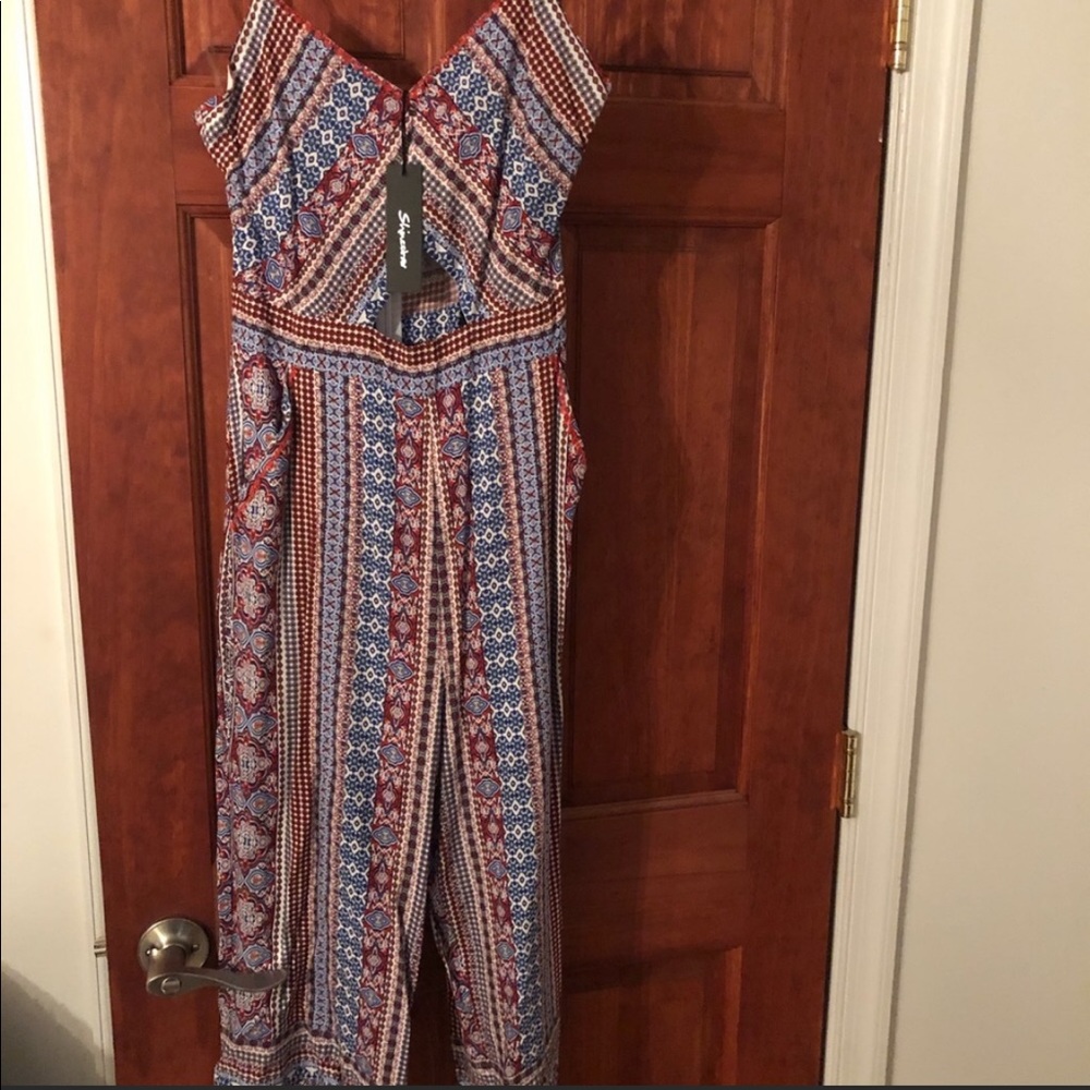 Brand new medium Capri romper never worn